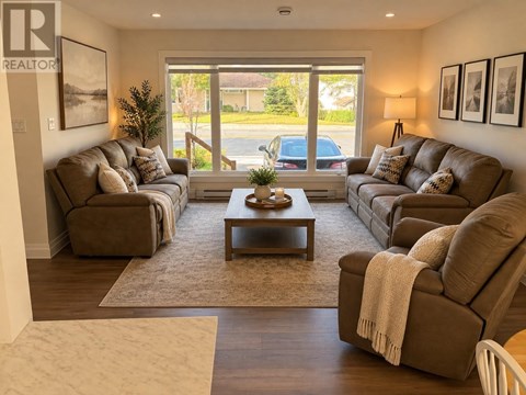 A living room with brown couches and a coffee table.