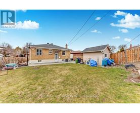 A house with a yard is for sale.