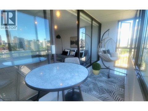 A living room with a marble table and a zebra print rug.