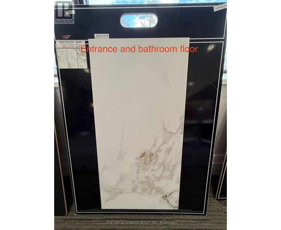 A white marble floor tile for entrance and bathroom.