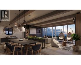 A modern dining room with a large table and chairs.