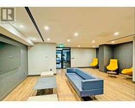 A conference room with a long table and chairs.