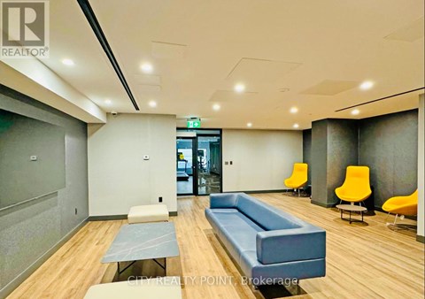 A conference room with a long table and chairs.