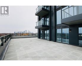 A modern building with a balcony overlooking a city skyline.