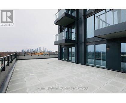 A modern building with a balcony overlooking a city skyline.