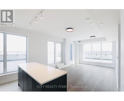 A spacious office with a large desk and a view of the street outside.