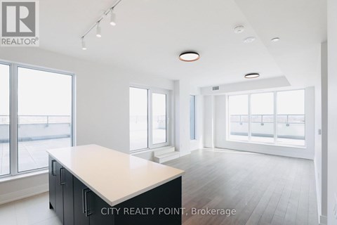 A spacious office with a large desk and a view of the street outside.