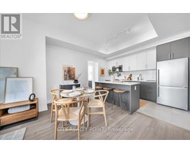 A modern kitchen with a dining table set for four.