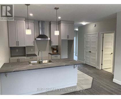 A kitchen with a sink and cabinets.