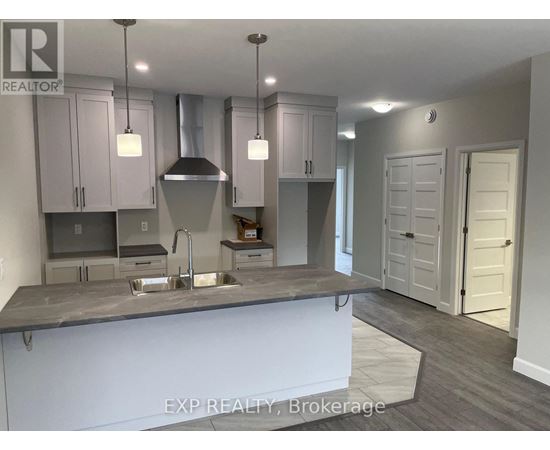 A kitchen with a sink and cabinets.