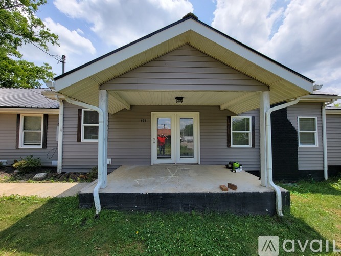 A house with a front porch and a white door.