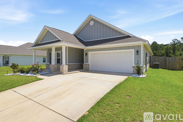 A house with a garage is available for sale.