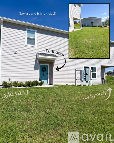 A house with a blue door and lawn care included.