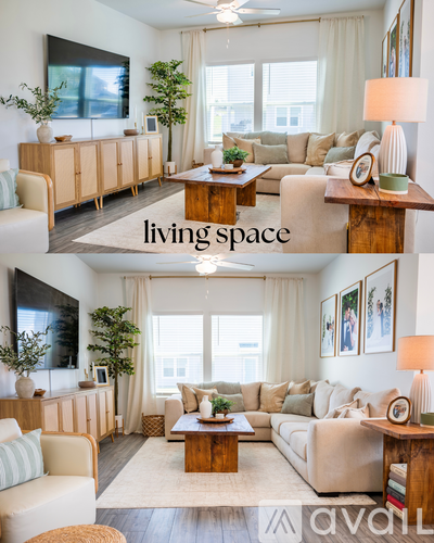 A living room with a white couch and a wooden coffee table.