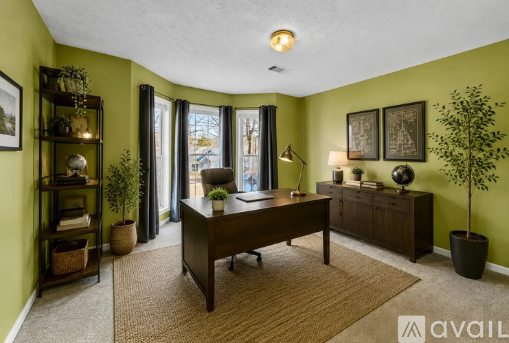 A living room with a couch, a coffee table, and a television.