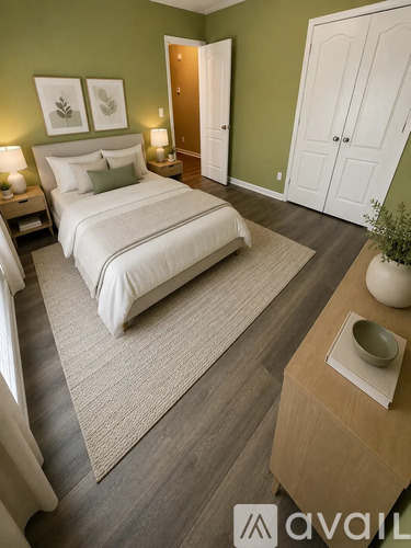 A room with green walls and a white door.