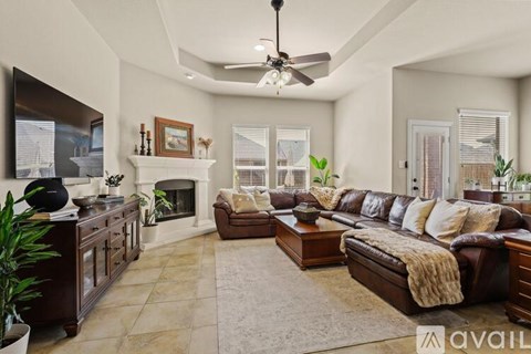 A living room with a fireplace and a couch.