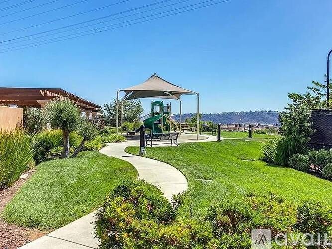 A park with a gazebo and walking path.