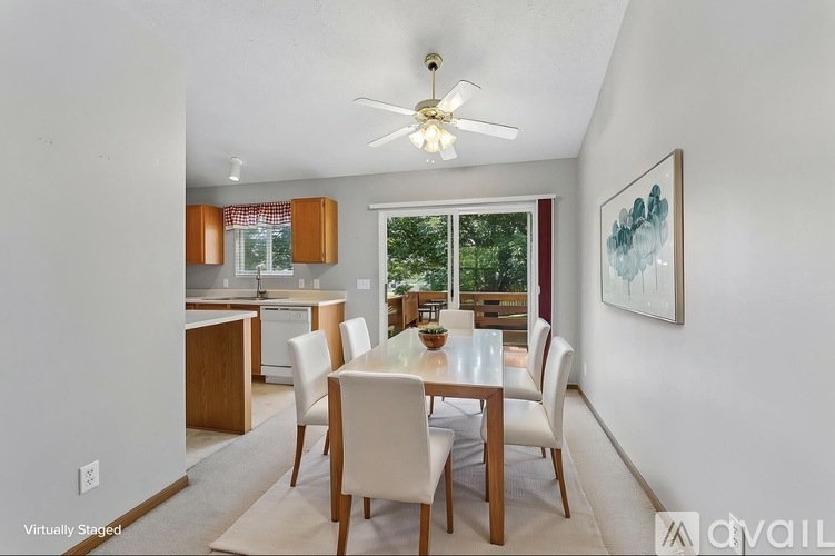 A dining room with a table set for six.