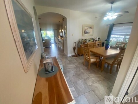 A dining room with a table and chairs is shown.