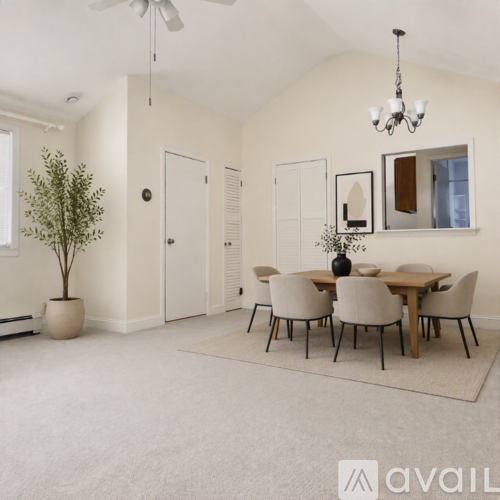 A dining room with a table set for six.