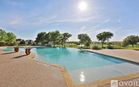 A sunny day at the pool with a clear blue sky.