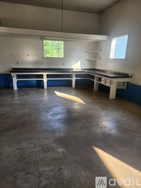 A room with a table and bench in it.
