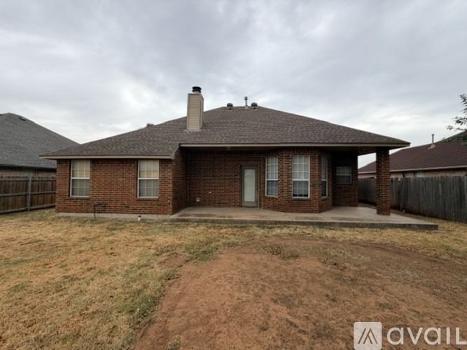 A house with a brown roof and a brick exterior is available for sale.
