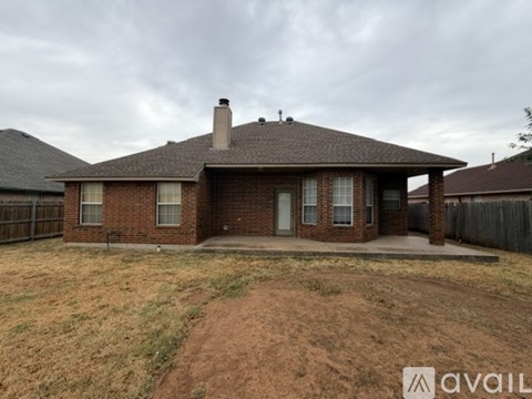 A house with a brown roof and a brick exterior is available for sale.