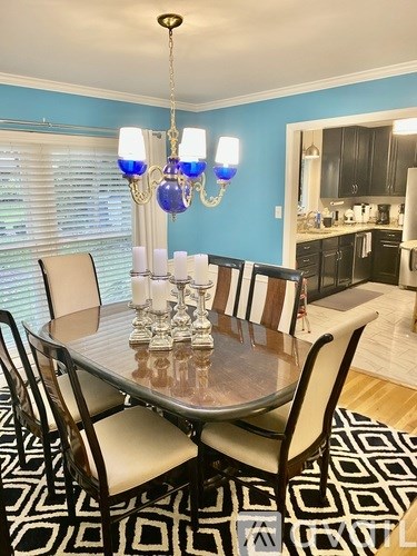 A dining room with a table set for six people.