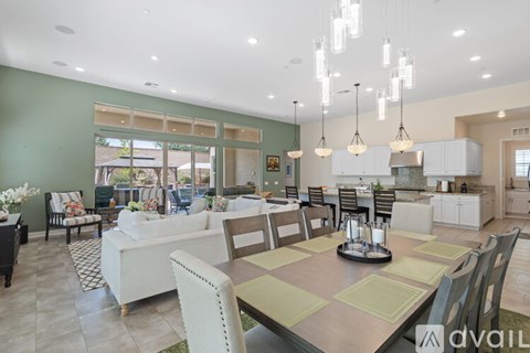 A modern kitchen with a dining table set for six.