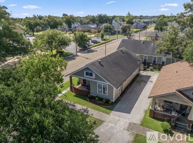 A bird's eye view of a residential area with houses and trees.