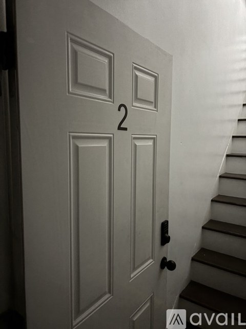 A white door with the number 2 on it.