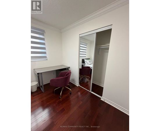 A room with a desk and a chair is shown in the image.