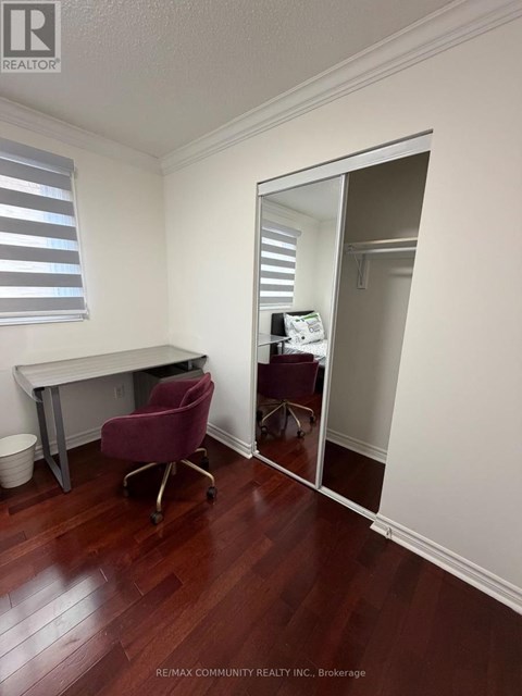 A room with a desk and a chair is shown in the image.