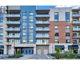 A multi-story apartment building with a Re/Max Realty Services Inc. sign in front.