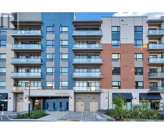 A multi-story apartment building with a Re/Max Realty Services Inc. sign in front.