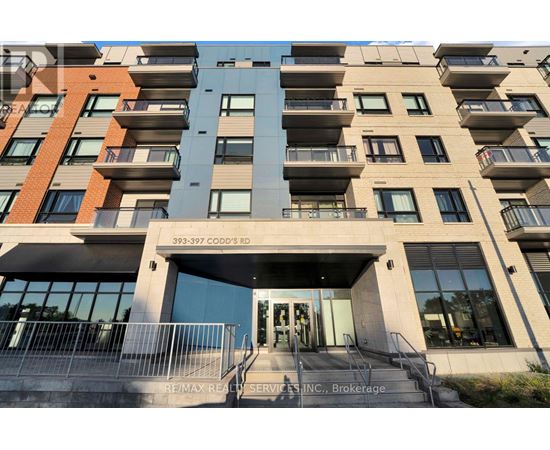 The building is a multi-story residential apartment with a glass entrance door.
