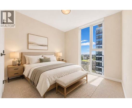 A bedroom with a large bed and a view of the city.