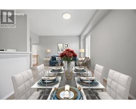 A dining room with a table set for six people.