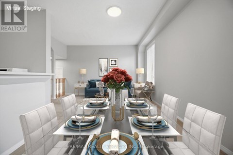 A dining room with a table set for six people.