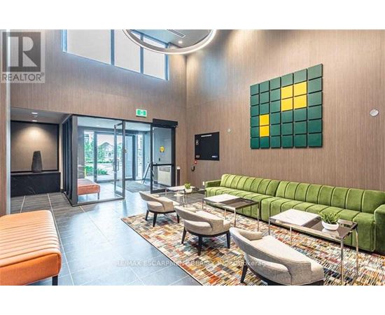 A living room with a green couch and a television.