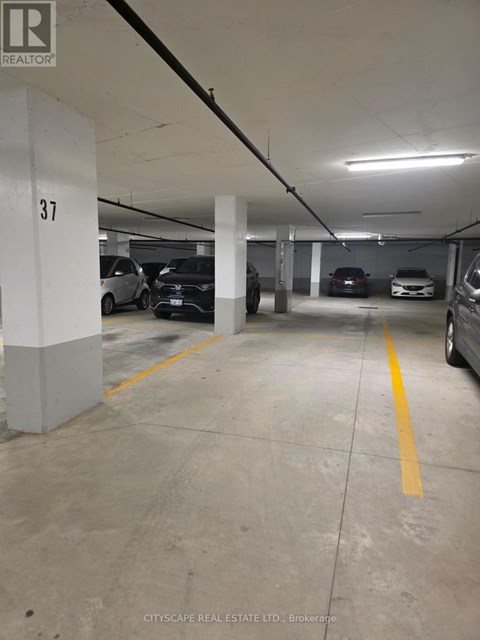 A parking garage with the number 37 on a pillar.