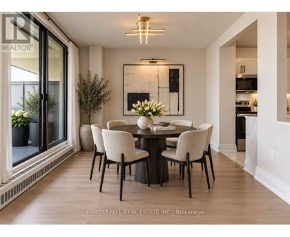 A dining room with a table set for four.