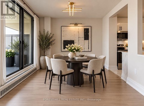 A dining room with a table set for four.