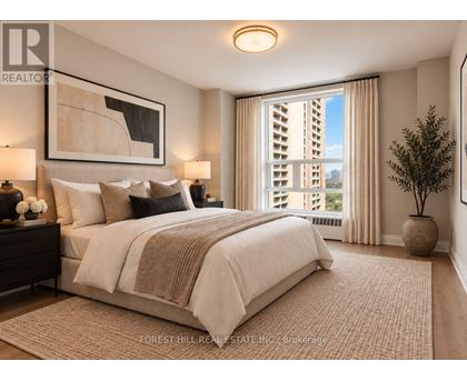 A bedroom with a large bed and a view of a building outside the window.