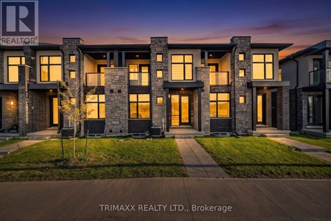 A modern house with a well-manicured lawn is showcased in the image.