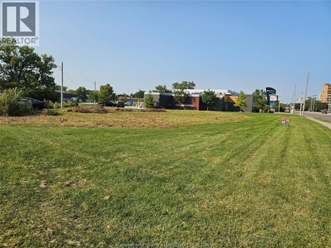 A large grassy field with a REALTOR® logo watermark.