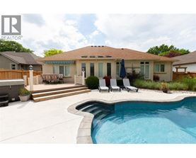 A house with a pool in the backyard.