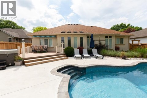 A house with a pool in the backyard.